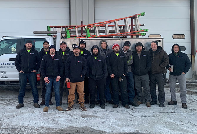 Teams of our technicians in front of a service truck. Door Systems Worcester, serving Webster, Southbridge & Sturbridge