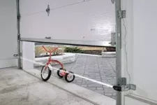 Bicycle under a closing garage door