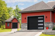 These garage doors are in the Moderno 2 beads design, 6' x 7' and 10' x 8', Black, window layout: Right-side Harmony.